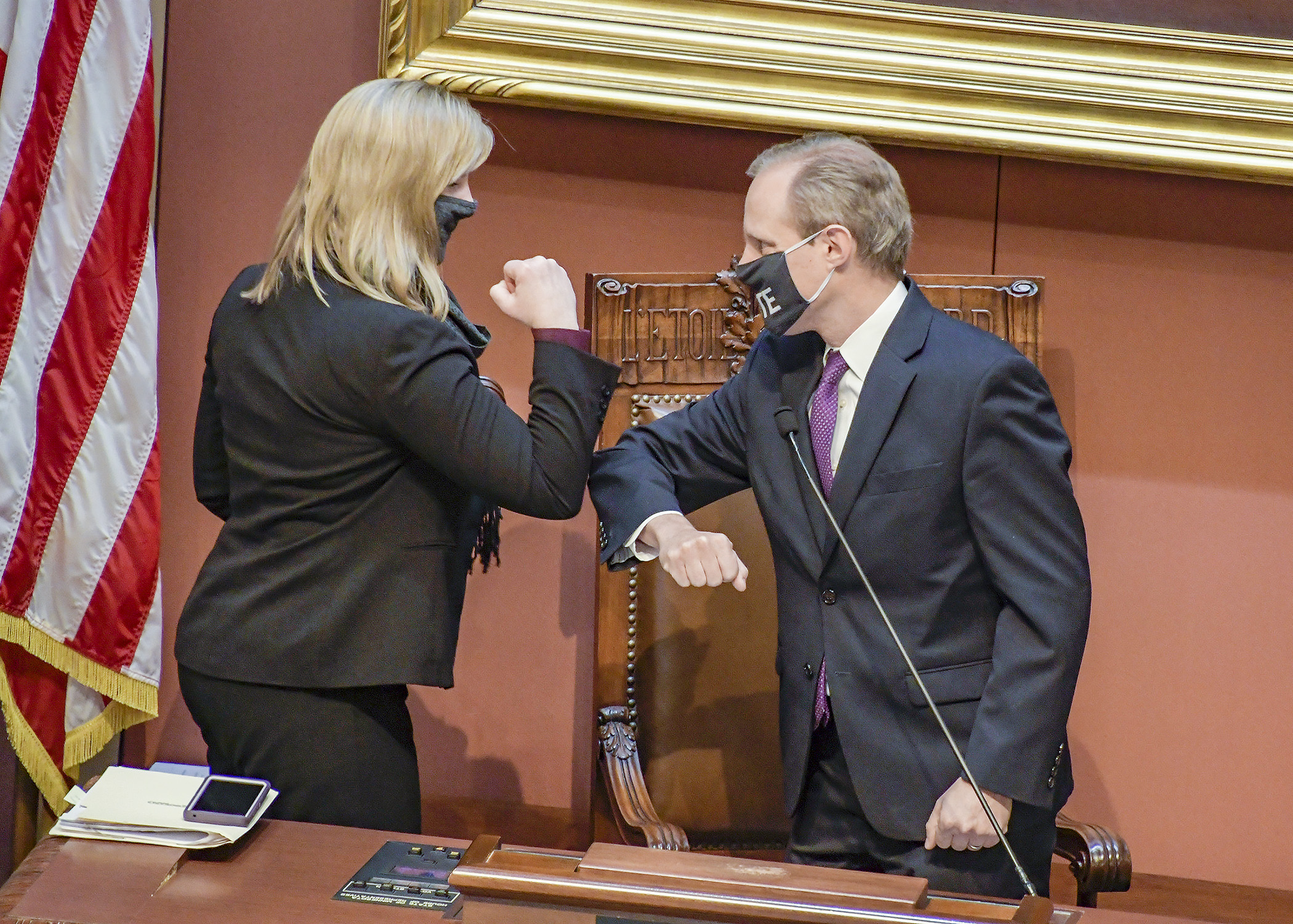 In lieu of shaking hands, Secretary of State Steve Simon and House Speaker Melissa Hortman bump elbows Tuesday after Hortman was again elected to the body’s top position. Photo by Andrew VonBank